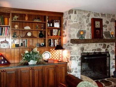 Wonderful den with large stone fireplace surrounde
