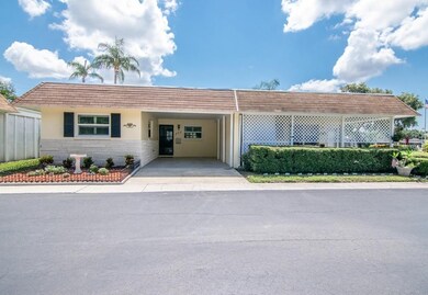 Dunedin villa end unit with carport ~