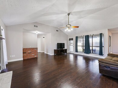 The main living area has engineered wood flooring.