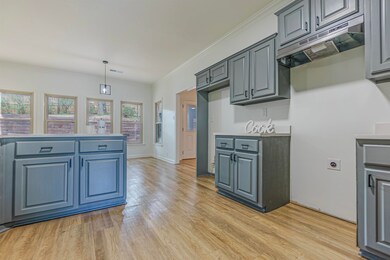 Kitchen with light hardwood / wood-style flooring,