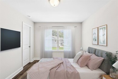 Bedroom featuring dark hardwood / wood-style floor