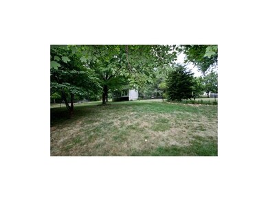 Two story workshop in fenced backyard