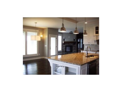 View of breakfast room and hearth room from kitche