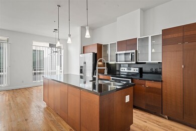 Sleek kitchen with modern fixtures and ample natur