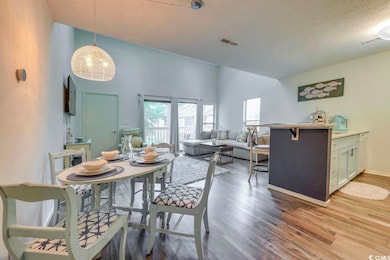Dining space featuring LVP-type flooring, plenty o