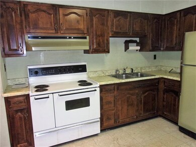 Kitchen comes equipped with electric stove and ref