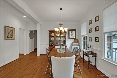 Dining space featuring a chandelier, ornamental mo