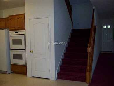 Property Photo. Staircase adjacent to kitchen/fami