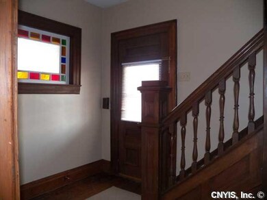 Foyer Natural woodwork, stained glass window and h