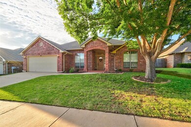 Home with a garage and a front lawn