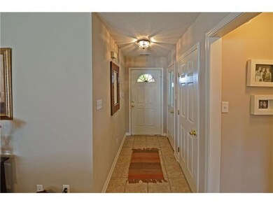 Tiled entry leads to open,vaulted greatroom and ki