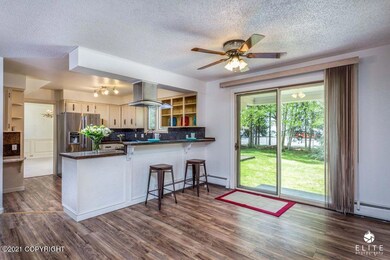 KITCHEN W/BREAKFAST BAR & DINING AREA