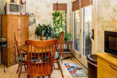 Eat-in kitchen opens to small deck