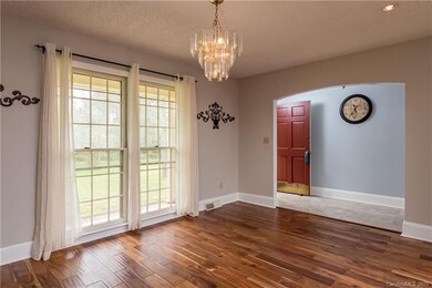 VIew from Dining room corner towards front entry. Note front yard.