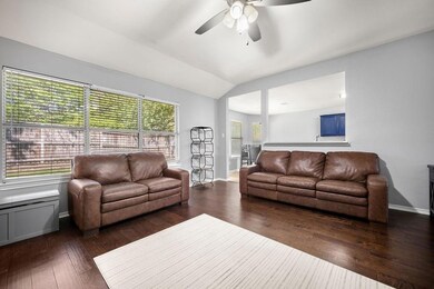 Living room with dark hardwood / wood-style floors