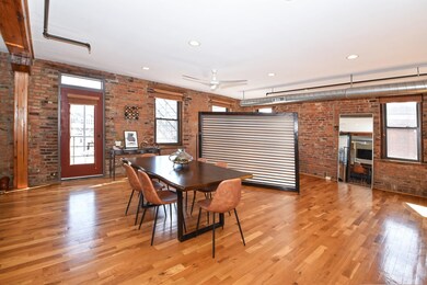 Behind the floating wall is a flex space. It is large enough for a pool table or guest bed.