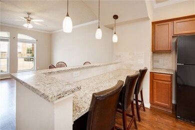 Kitchen featuring backsplash, freestanding refrige