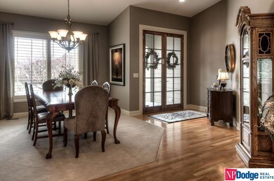New top of line double French entry doors open to the graceful entry and formal dining.