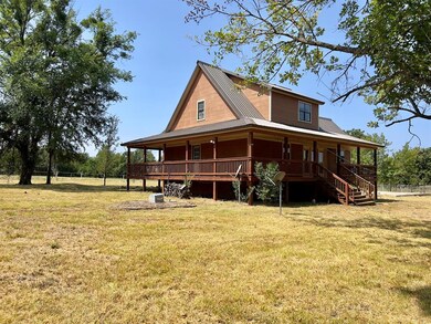 Back of house featuring a lawn