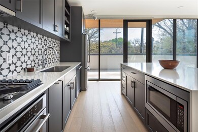 Kitchen with light wood-style floors, light count