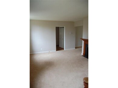 Living Room. Large bright space features a firepla