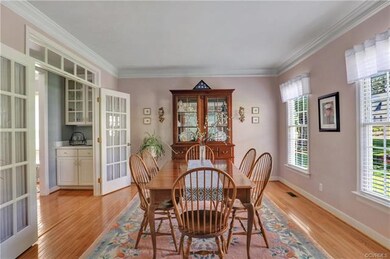 Dining Room: French doors to wet bar area between 