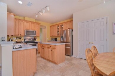 Island kitchen with new appliances.