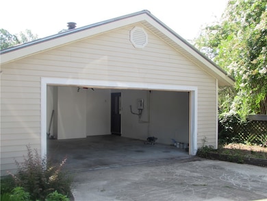 Garage is double with additional parking spaces.