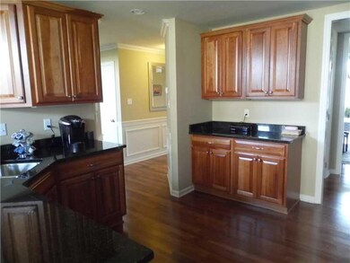 Kitchen. UPGRADED CABINETRY, GRANITE COUNTERS WITH