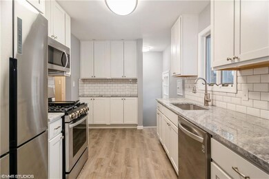 Stainless steel appliances. Pantry area in kitchen