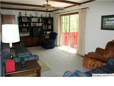 Den with sliding patio doors