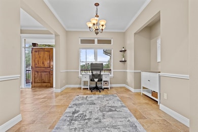 Office space featuring stone tile floors, a chand