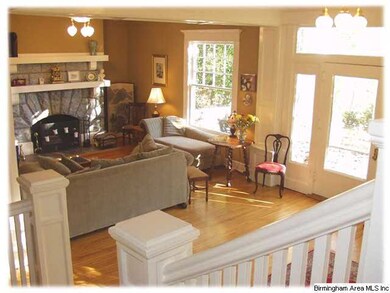 A view of the front door and living room from the 