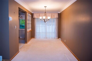 Formal Dining room with a large patio door over lo