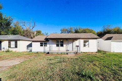 Single story home with a front lawn and a shingled roof