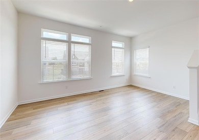 Spare room with light hardwood / wood-style floors