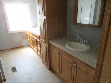 Master bath with double sinks and cupboards