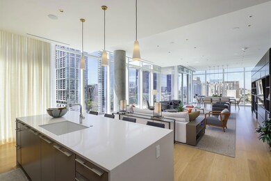 Kitchen with a sink, modern cabinets, expansive wi
