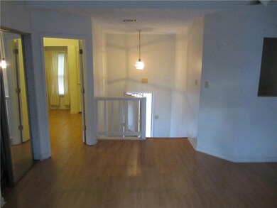 Foyer with visible vents, baseboards, and wood fin
