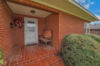 Cute front porch for visiting with neighbors in this freindly well established neighborhood