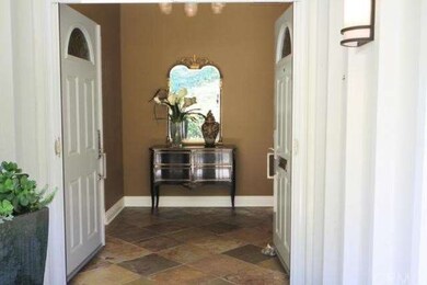 As soon as you open the double doors to this house