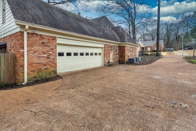 View of property exterior with central AC, roof wi
