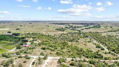 Birds eye view of property with a rural view