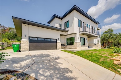 View of front of home featuring stone siding, stu