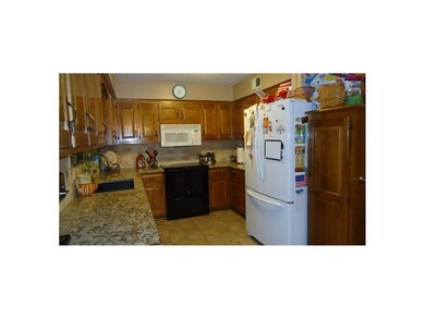 Another view of kitchen with stone sink.