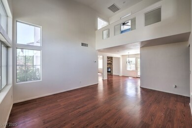 Unfurnished living room with visible vents, a towe