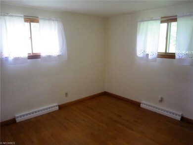 Beautifully refurbished hardwood floors are throug