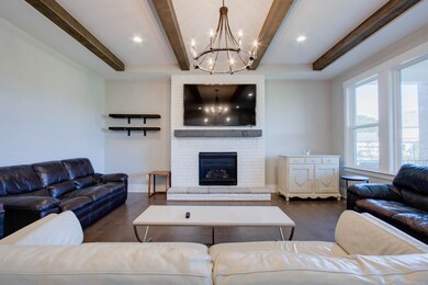 Spacious open living area into kitchen and dining area.