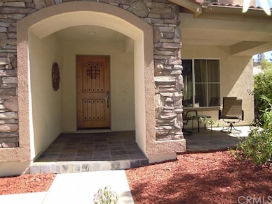 Beautiful tiled front porch to sit and enjoy the q
