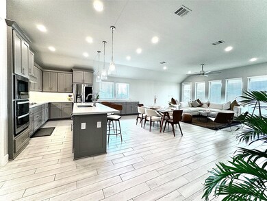 Seamlessly designed open-concept living space, per